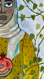 Noora with two pomegranates