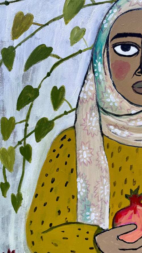 Noora with two pomegranates