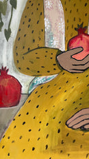 Noora with two pomegranates