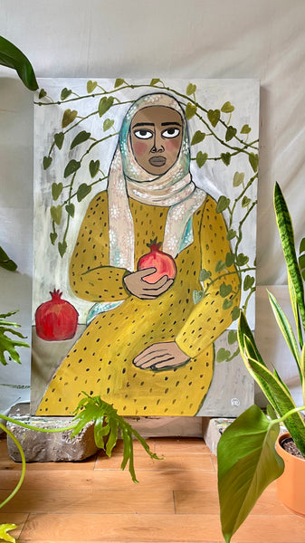 Noora with two pomegranates